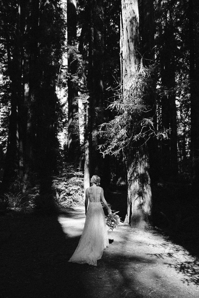 A bride walks to her first look during their Samuel H Boardman State Park Elopement