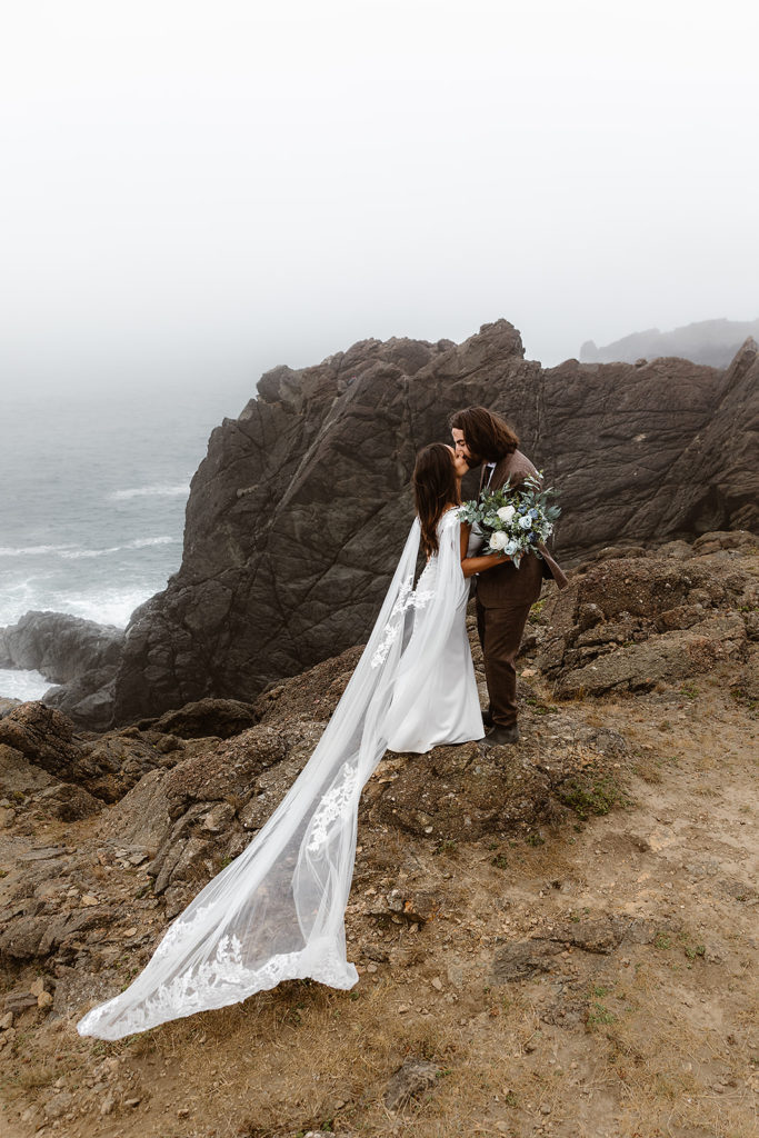 A couple kisses during their Samuel H Boardman State Park Elopement