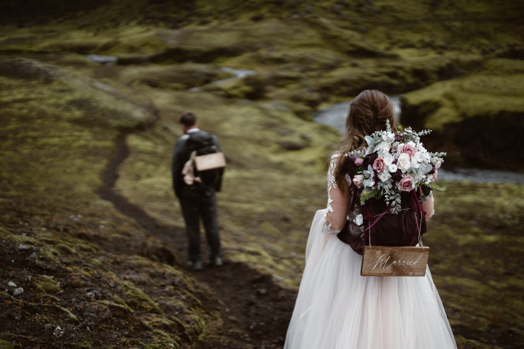 A couple hikes during their Iceland elopement