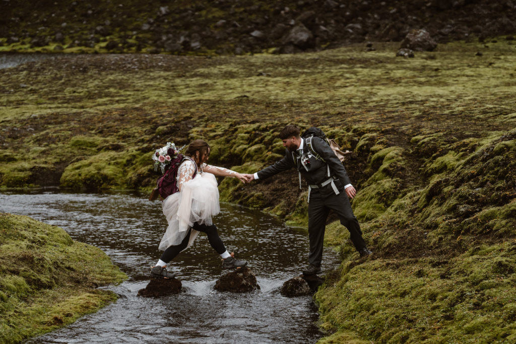 A couple hikes together during their Iceland elopement