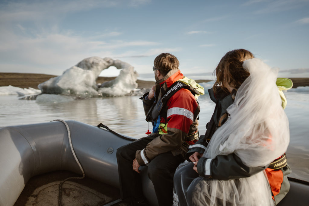 A couple looks at glaciers during their Iceland elopement