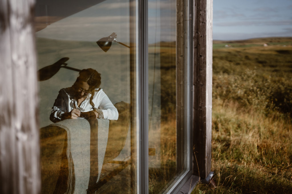 A bride writes her vows at her Airbnb during her Iceland elopement
