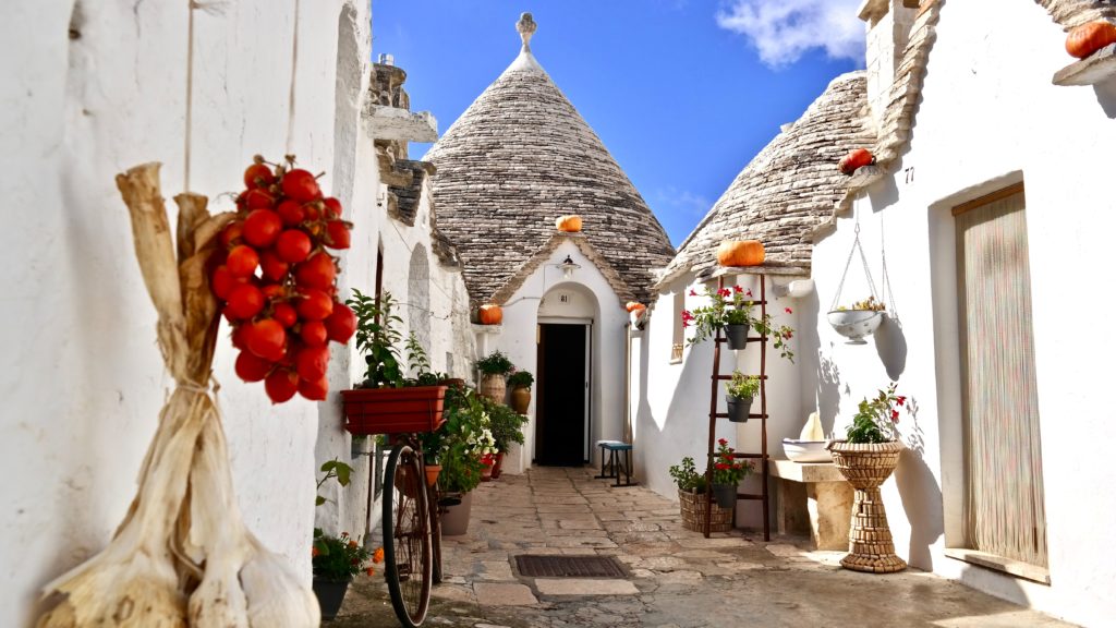 A photo of Trulli homes in Alberobello, white homes with pointy roofs