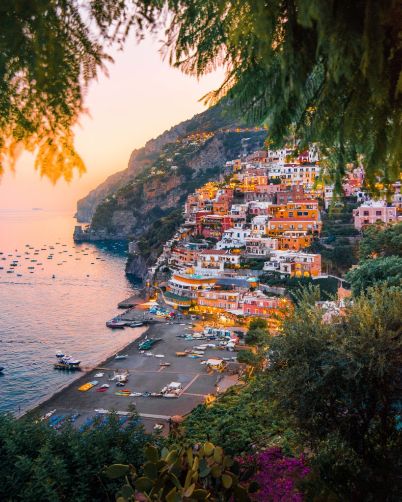 The pastel colored buildings of Positano on the Amalfi Coast at sunset