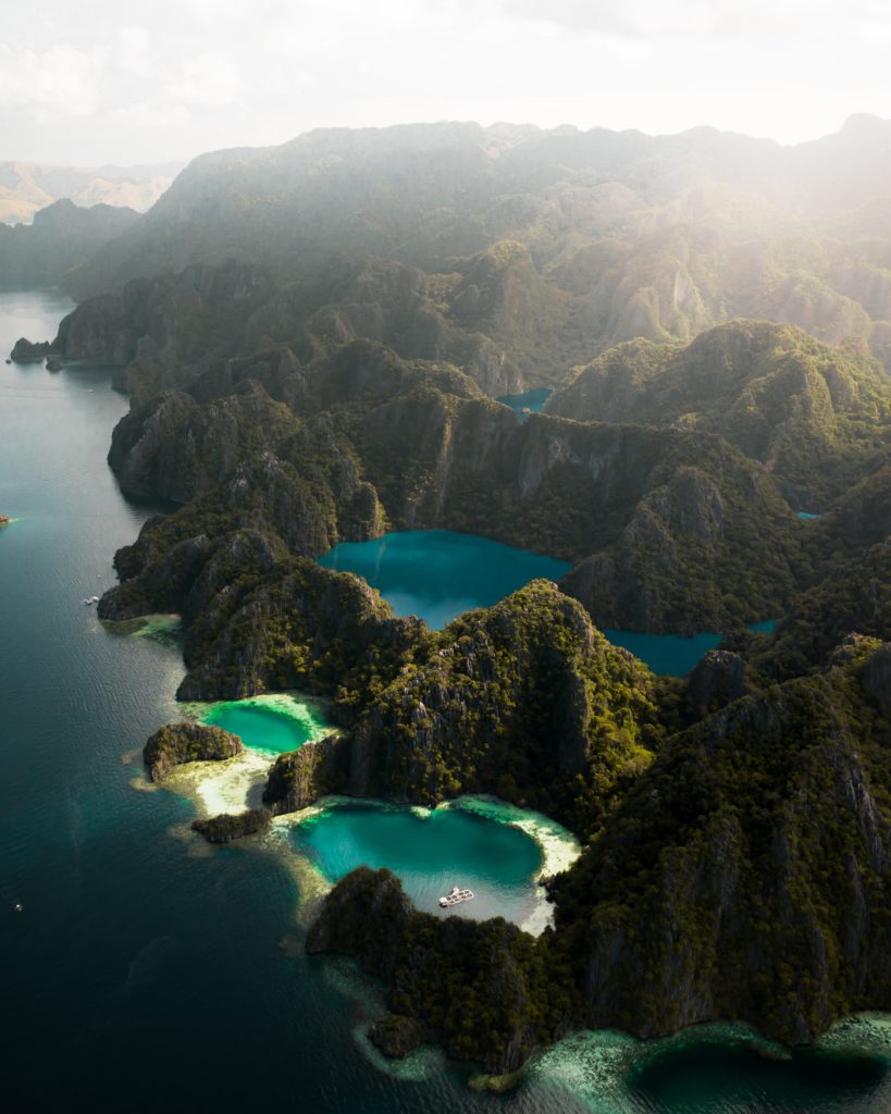 Crystal clear lagoons in the middle of foresty mountains in Coron, the Philippines