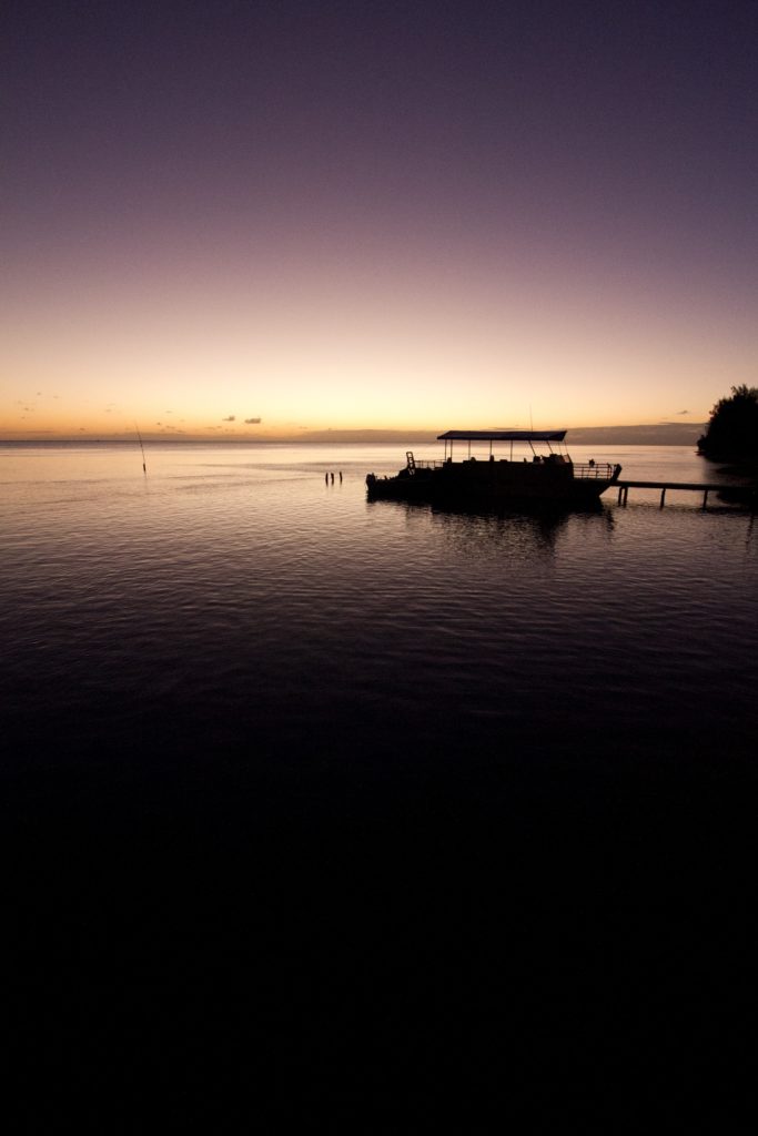 the main Aitutaki island surrounded by a glassy flat lagoon and a sense of peace.