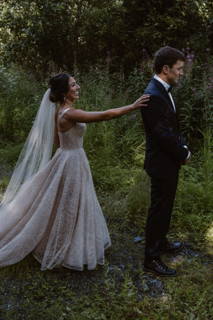 A couple does their first look before their Alaska elopement