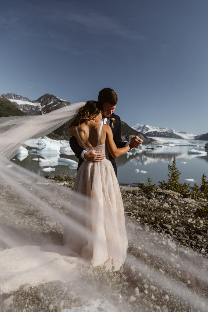 A couple dances in the Alaskan backcountry during their Alaska elopement
